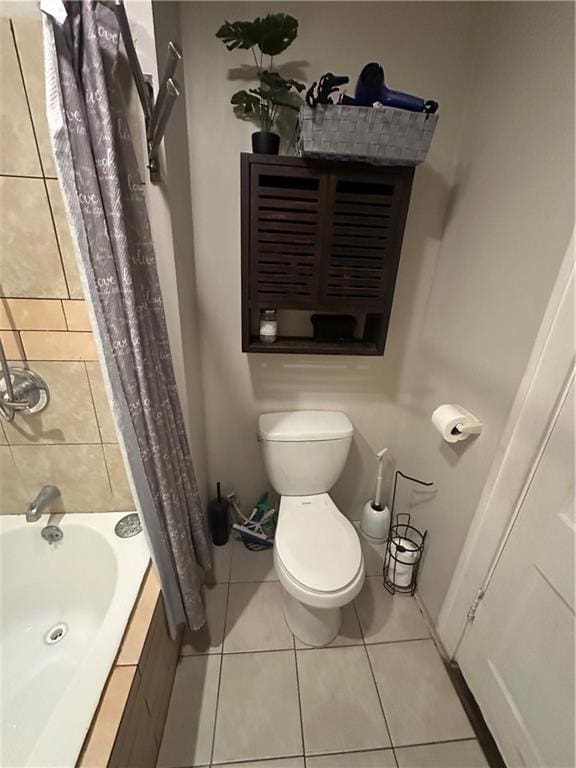 3823 Ruby Ave, Kansas City, KS 66106 - full bath with shower / tub combo with curtain and tile patterned flooring