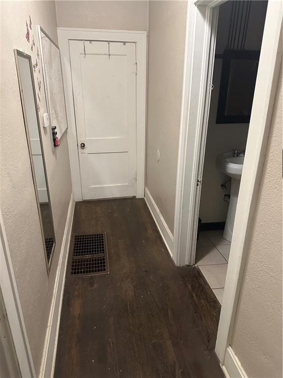 3823 Ruby Ave, Kansas City, KS 66106 - corridor featuring wood finished floors and baseboards