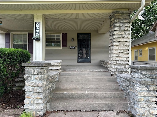 305 E Main St, Richmond, MO 64085 - property entrance featuring a porch