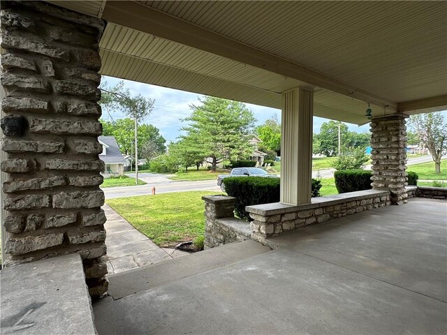 305 E Main St, Richmond, MO 64085 - covered porch featuring a lawn
