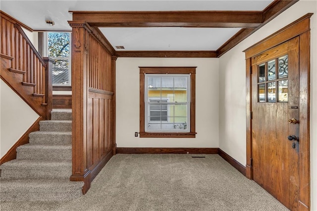 305 E Main St, Richmond, MO 64085 - carpeted foyer featuring stairs and ornamental molding