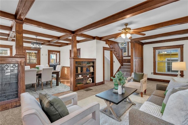 305 E Main St, Richmond, MO 64085 - living room featuring carpet, beam ceiling, stairs, a fireplace, and coffered ceiling