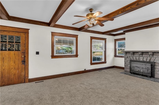 305 E Main St, Richmond, MO 64085 - unfurnished living room featuring carpet floors, a fireplace, beamed ceiling, and ceiling fan