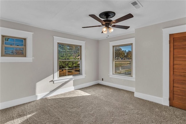 305 E Main St, Richmond, MO 64085 - carpeted empty room with a ceiling fan and crown molding