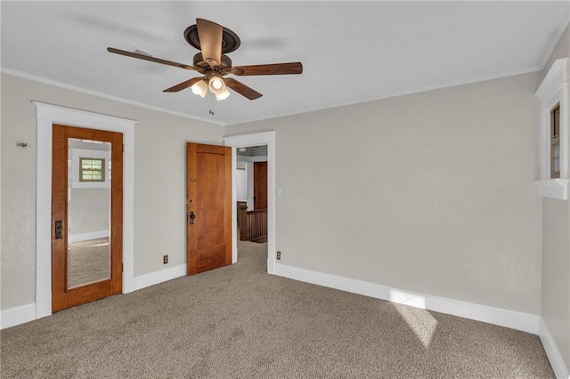305 E Main St, Richmond, MO 64085 - unfurnished bedroom featuring carpet floors, crown molding, and a ceiling fan