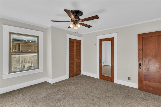 305 E Main St, Richmond, MO 64085 - unfurnished bedroom featuring carpet floors, ornamental molding, a closet, and a ceiling fan