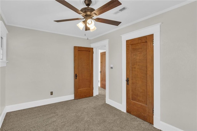 305 E Main St, Richmond, MO 64085 - unfurnished bedroom featuring carpet, crown molding, and a ceiling fan