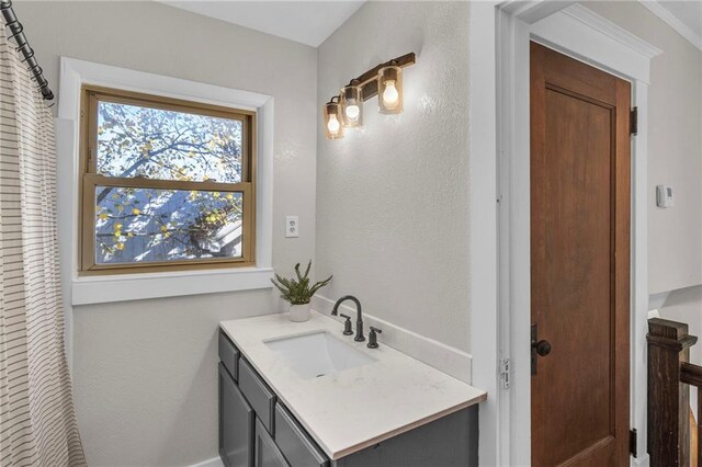 305 E Main St, Richmond, MO 64085 - bathroom with vanity and a textured wall