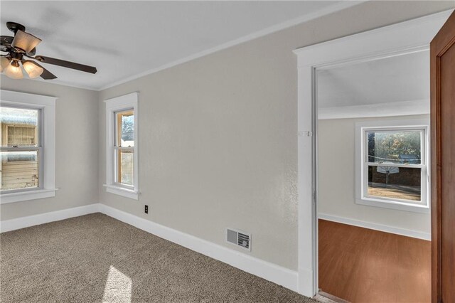 305 E Main St, Richmond, MO 64085 - empty room featuring ceiling fan and ornamental molding