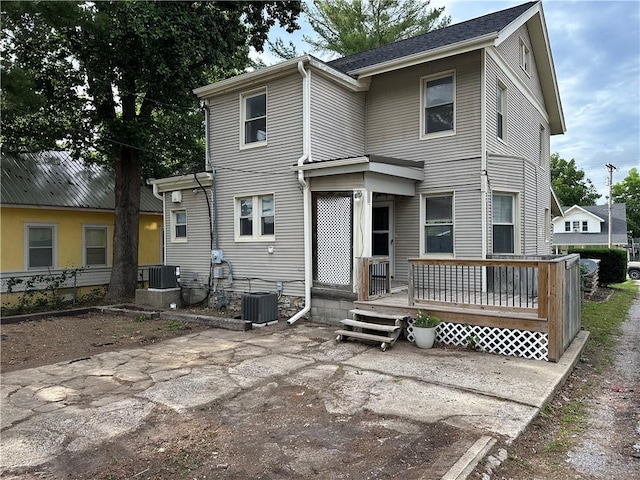 305 E Main St, Richmond, MO 64085 - rear view of property with a patio area and a wooden deck