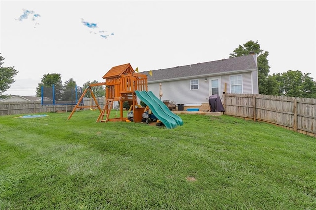 580 SE 110th St, Warrensburg, MO 64093 - view of playground featuring a trampoline and a fenced backyard