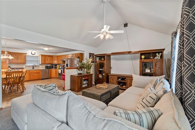 606 S Thornton St, Richmond, MO 64085 - living area featuring a ceiling fan, light wood-type flooring, and high vaulted ceiling