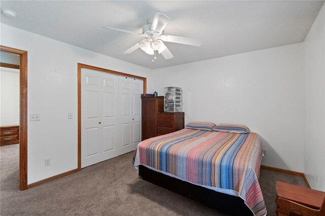 606 S Thornton St, Richmond, MO 64085 - carpeted bedroom with a closet and ceiling fan