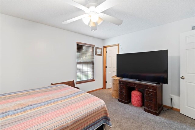 606 S Thornton St, Richmond, MO 64085 - bedroom with carpet flooring and a ceiling fan