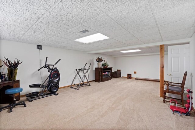 606 S Thornton St, Richmond, MO 64085 - exercise area with carpet floors, a drop ceiling, and baseboard heating