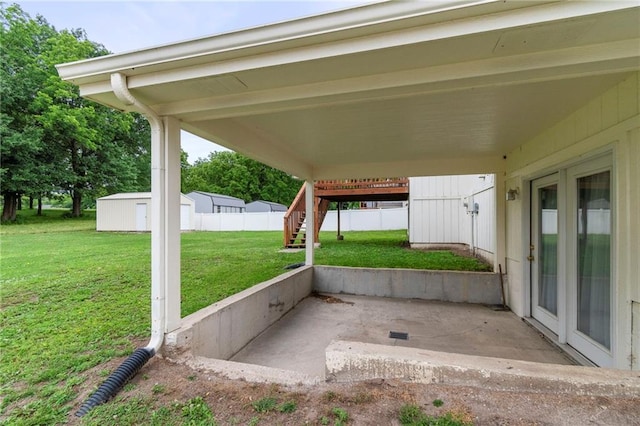 606 S Thornton St, Richmond, MO 64085 - view of patio / terrace with stairway and a shed