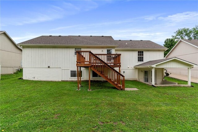 606 S Thornton St, Richmond, MO 64085 - rear view of house with stairs, a wooden deck, and a lawn