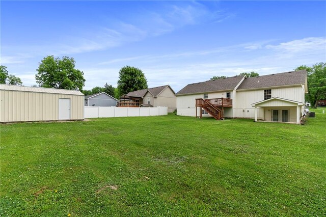 606 S Thornton St, Richmond, MO 64085 - view of yard featuring stairway and a deck
