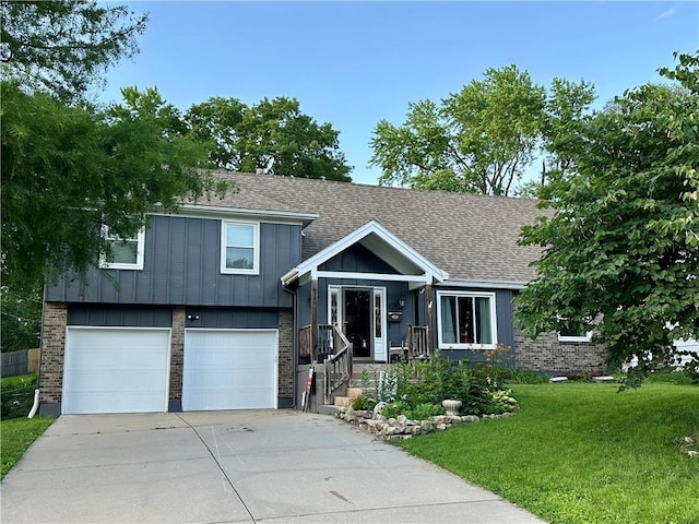 8708 W 92nd St, Overland Park, KS 66212 - split level home with concrete driveway, a front lawn, a garage, and brick siding