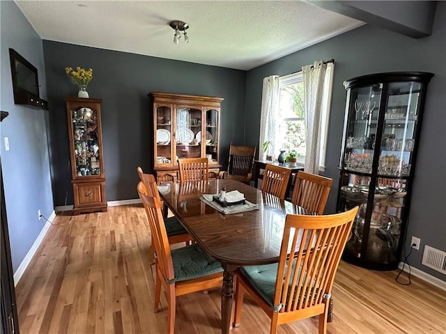 8708 W 92nd St, Overland Park, KS 66212 - dining area with light wood finished floors and baseboards