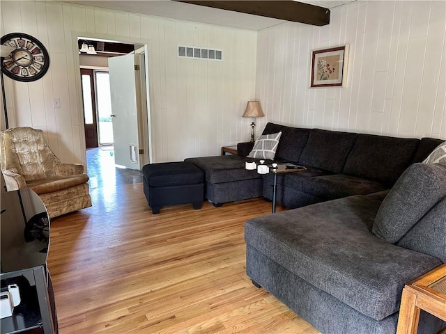 8708 W 92nd St, Overland Park, KS 66212 - living area with light wood-style flooring, beam ceiling, and wooden walls