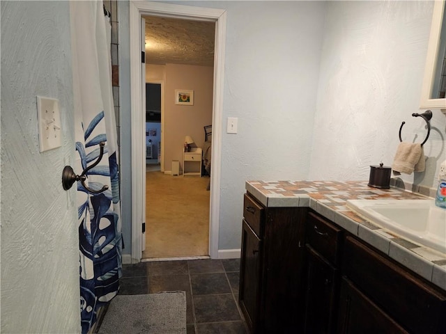 8708 W 92nd St, Overland Park, KS 66212 - bathroom with vanity, a textured ceiling, and tile patterned floors