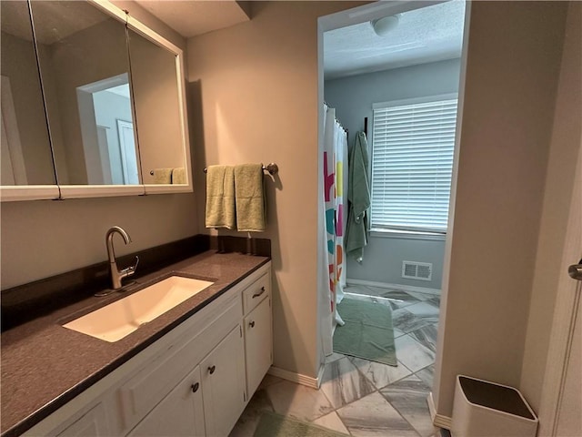 8708 W 92nd St, Overland Park, KS 66212 - full bathroom featuring vanity, a shower with curtain, and marble finish floors
