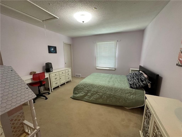 8708 W 92nd St, Overland Park, KS 66212 - bedroom featuring attic access, light colored carpet, a textured ceiling, and a desk