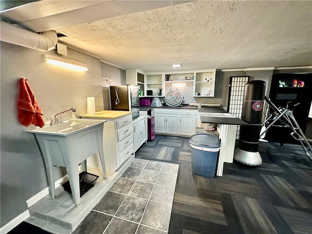 8708 W 92nd St, Overland Park, KS 66212 - kitchen featuring freestanding refrigerator, open shelves, a textured ceiling, white cabinets, and dark countertops