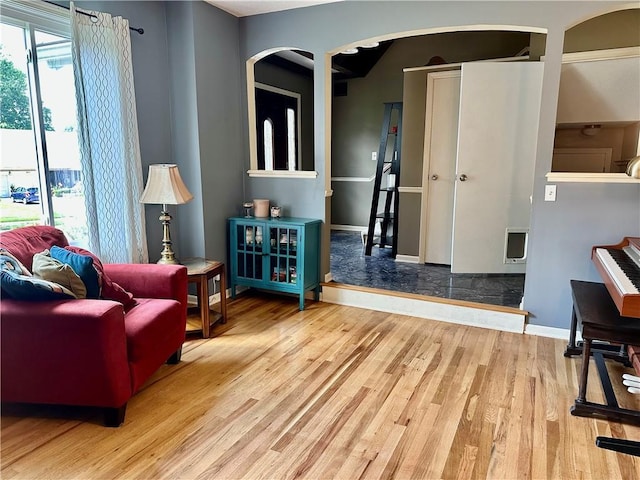 8708 W 92nd St, Overland Park, KS 66212 - sitting room featuring arched walkways and wood finished floors