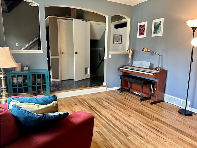 8708 W 92nd St, Overland Park, KS 66212 - living area with wood finished floors and arched walkways