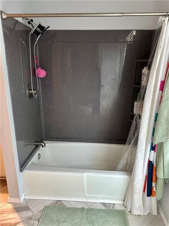 8708 W 92nd St, Overland Park, KS 66212 - full bath featuring shower / bathtub combination with curtain and baseboards