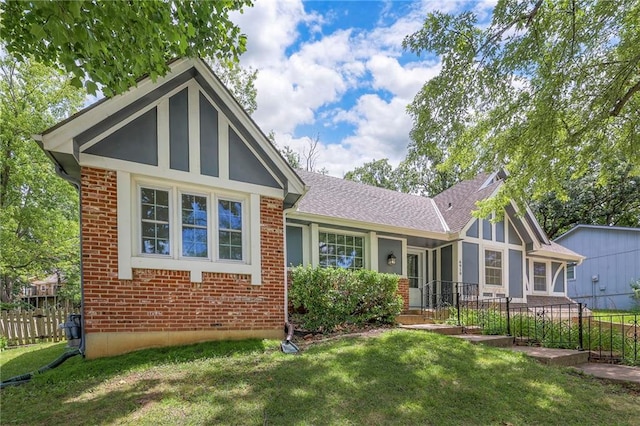 6919 Albervan St, Shawnee, KS 66216 - view of front of property with brick siding and roof with shingles