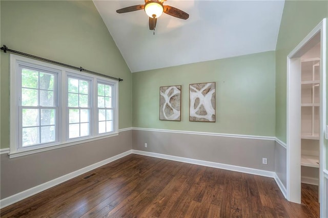 6919 Albervan St, Shawnee, KS 66216 - empty room featuring a ceiling fan, dark wood-style floors, and lofted ceiling