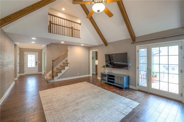 6919 Albervan St, Shawnee, KS 66216 - unfurnished living room with high vaulted ceiling, stairs, ceiling fan, dark wood-style flooring, and beam ceiling