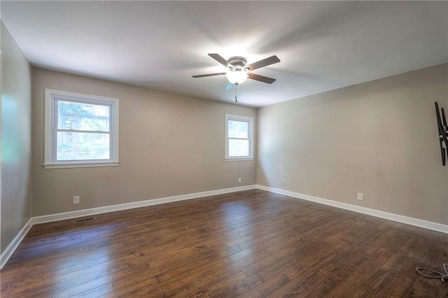 6919 Albervan St, Shawnee, KS 66216 - empty room with ceiling fan and dark wood-type flooring