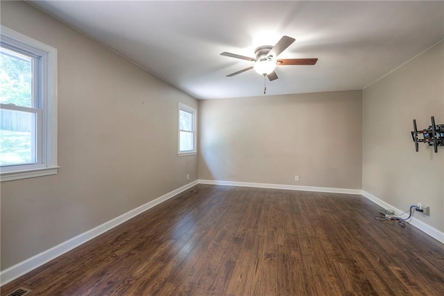 6919 Albervan St, Shawnee, KS 66216 - spare room with ceiling fan and dark wood-type flooring