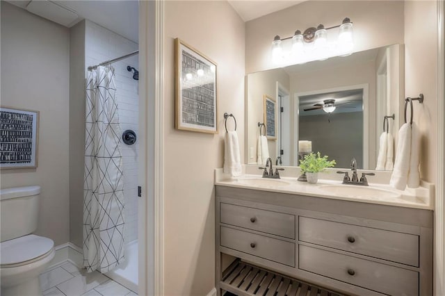 6919 Albervan St, Shawnee, KS 66216 - bathroom with double vanity, ceiling fan, a shower with shower curtain, and tile patterned flooring