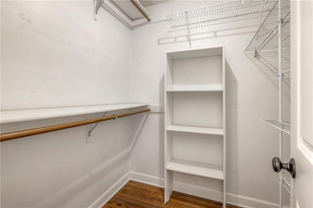 6919 Albervan St, Shawnee, KS 66216 - walk in closet featuring wood finished floors