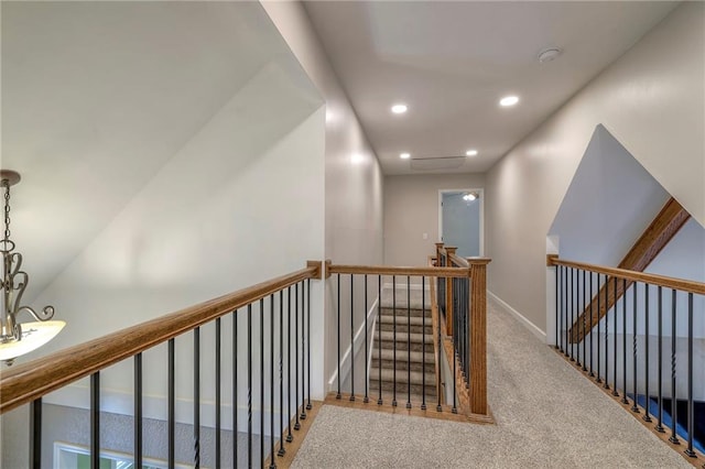 6919 Albervan St, Shawnee, KS 66216 - corridor with an upstairs landing, recessed lighting, and carpet