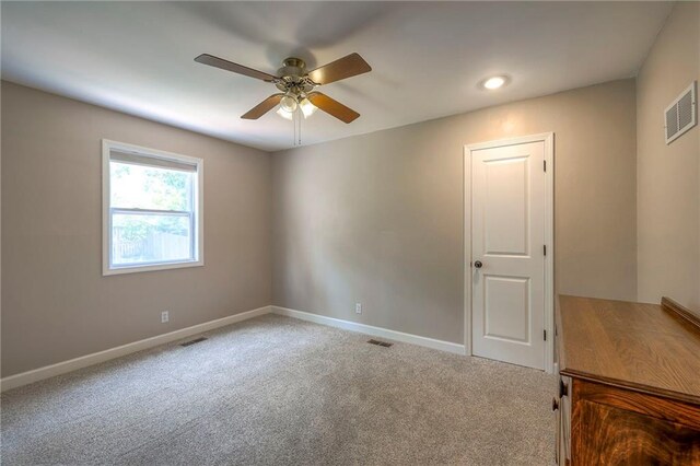 6919 Albervan St, Shawnee, KS 66216 - empty room featuring a ceiling fan and carpet flooring