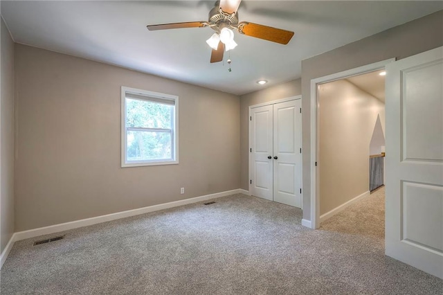 6919 Albervan St, Shawnee, KS 66216 - unfurnished bedroom with carpet, a closet, and ceiling fan
