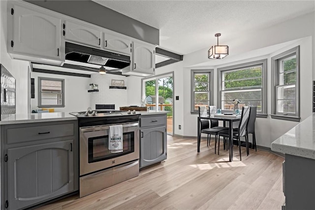 1208 SW Speas Dr, Blue Springs, MO 64014 - kitchen featuring stainless steel electric range, gray cabinets, light wood-type flooring, and a textured ceiling