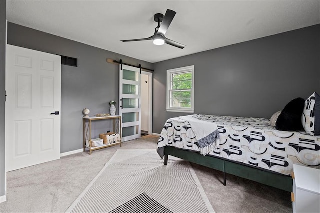 1208 SW Speas Dr, Blue Springs, MO 64014 - bedroom featuring carpet, a barn door, and ceiling fan