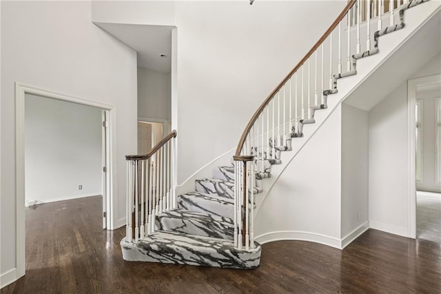 12909 Maple St, Overland Park, KS 66209 - stairway featuring wood finished floors and a high ceiling