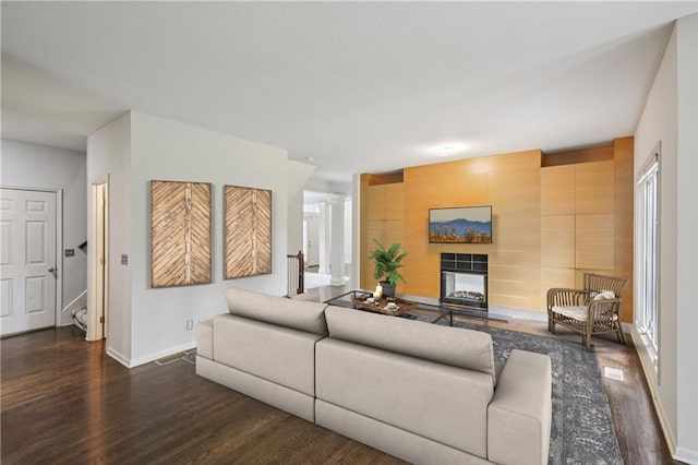 12909 Maple St, Overland Park, KS 66209 - living area featuring wood finished floors and a multi sided fireplace