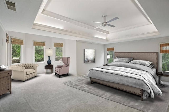 12909 Maple St, Overland Park, KS 66209 - bedroom featuring a raised ceiling, crown molding, carpet flooring, multiple windows, and a ceiling fan