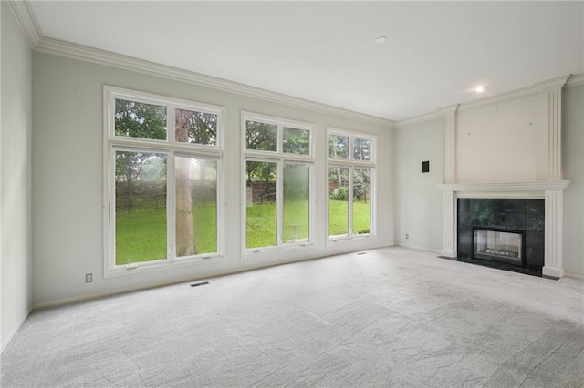 12909 Maple St, Overland Park, KS 66209 - unfurnished living room with crown molding, carpet, healthy amount of natural light, and a tiled fireplace