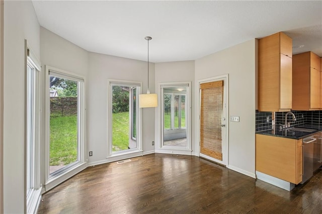 12909 Maple St, Overland Park, KS 66209 - unfurnished dining area featuring a sink and dark wood finished floors