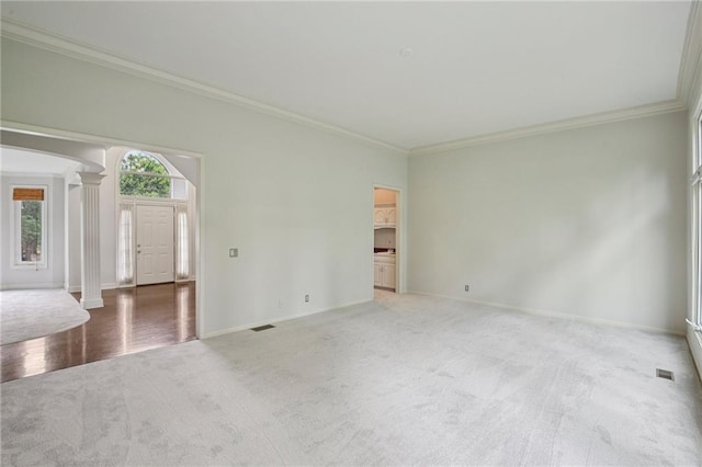 12909 Maple St, Overland Park, KS 66209 - carpeted empty room featuring decorative columns and ornamental molding